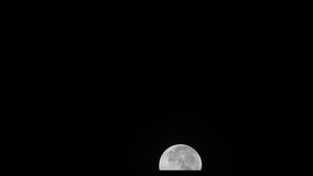 full moon on a dark night, clear moving up on background,HD video time lapse