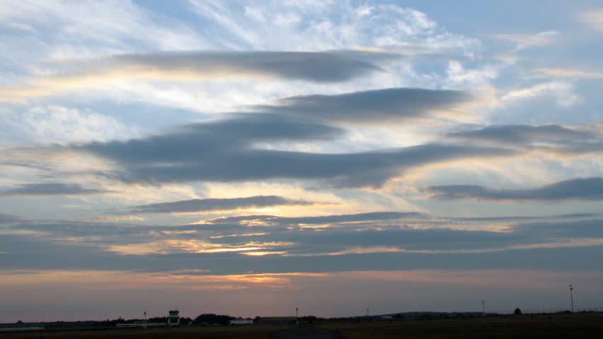 Time lapse sequence of sunset over an airport