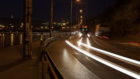 Vehicles in city making light trails time lapse sequence in 4K UHD