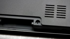 Laptop repair - screw removal close up