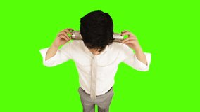 Locked-on shot of a young businessman using tin can phone on green background
