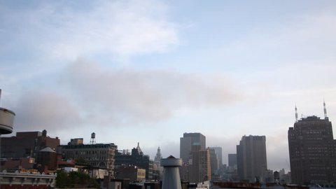 clouds moving across the sky from a new york rooftop