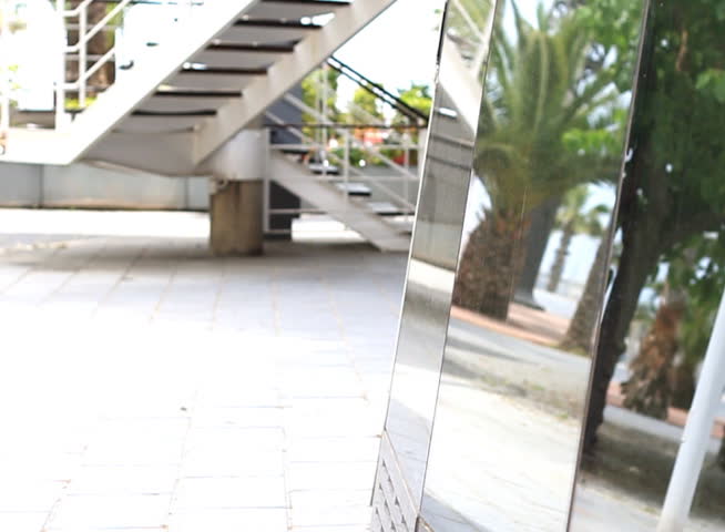 Young woman walking in an urban environment, 60fps