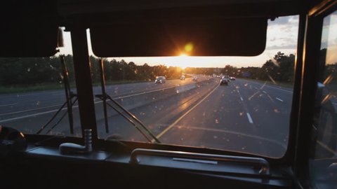 Busride. Sunset. Riding at the front of a greyhound bus on Hwy 401, Ontario, Canada. Sunset. 