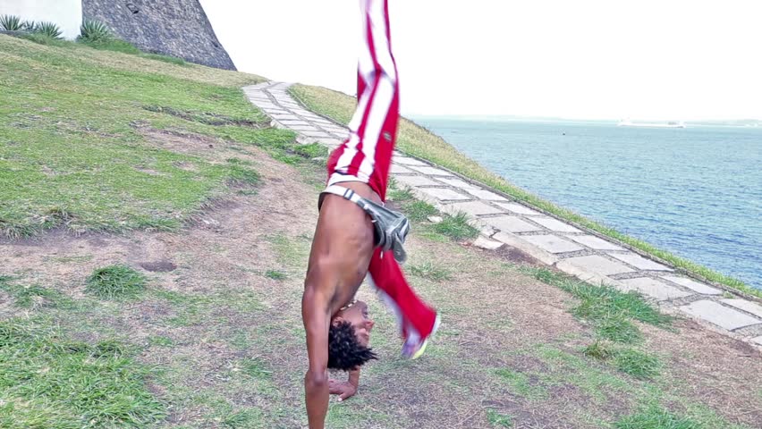 Capoeira artist performs on Barra Lighthouse in Salvador, Brazil