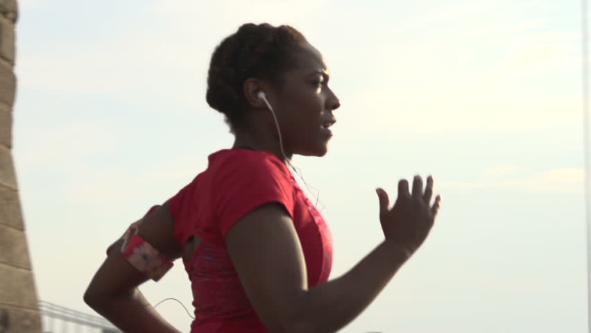 A female jogger on Brooklyn Bridge, New York - slow motion Royalty-Free Stock Footage #7973143