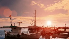Twilight in the peaceful fishing port ; Fishing boats anchored in a peaceful Mediterranean port at the sunset,video clip