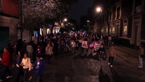 Mexico City, 08/Nov/14. FULL SHOT-PAN LEFT. Crowd in a march protest for the 43 students disappeared in Ayotzinapa Guerrero. The mexican government confront a lack of credibility by these events