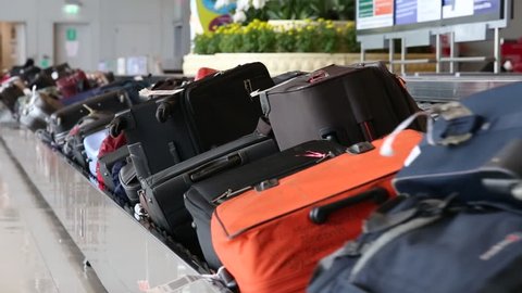 BANGKOK, THAILAND - NOVEMBER 14, 2014: Baggage conveyor belt in the Suvarnabhumi Airport carrying the passenger luggage.