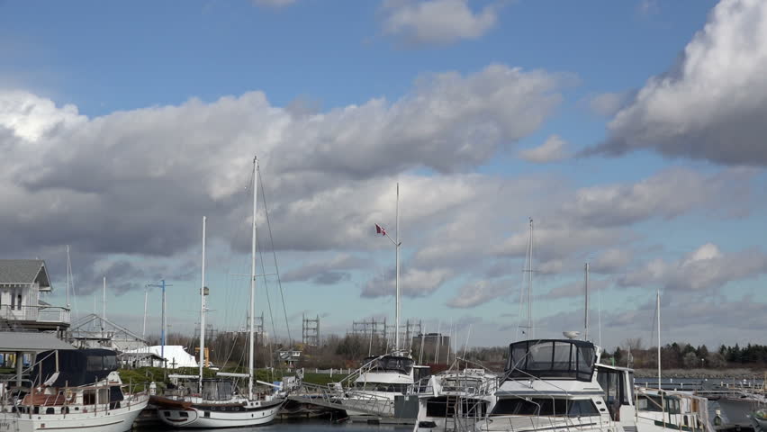 Canadian Flag at the Yacht Club. Zoom-in, Canadian Flag at the Yacht Club blowing in the wind.