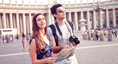 Young Tourists Exploring Rome Map Vacation Concept Taking Pictures