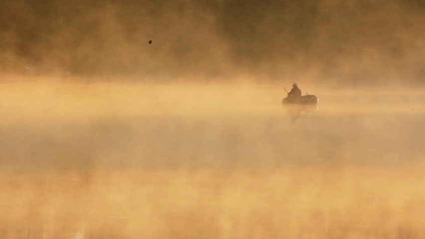 morning fishing on river in fog