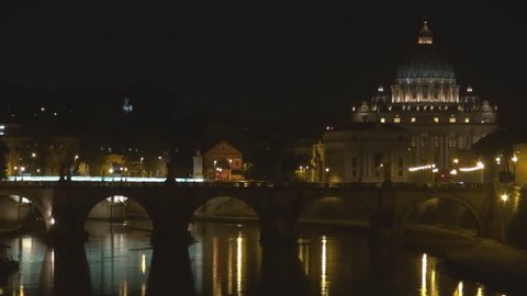 Timelapse of Dome of San Pietro church at Vatican, Rome cityscape by night with water reflection 