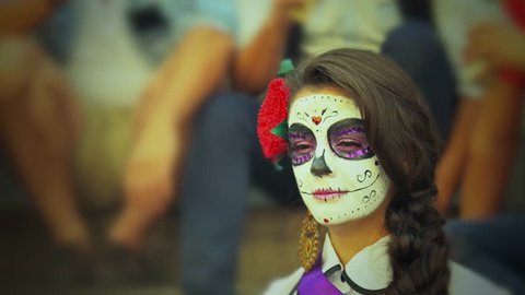 GUANAJUATO, MEXICO-02 NOVEMBER 2014:Young woman in day of the dead mask skull face art. Halloween face art. 4k