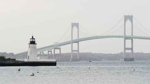 Goat Island in Newport, Rhode Island Harbor with bridge in the background daytime.