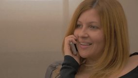 Blond woman talking on phone FullHD 1080p UHD slow motion footage -  Female talking on cell phone 1920X1080 slow-mo HD video