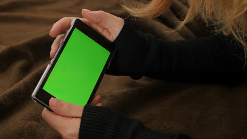 Green screen mobile phone display in blon woman hands 4K 2160p UHD video - Woman holding green screen smart phone display 4K 3840X2160 UHD footage