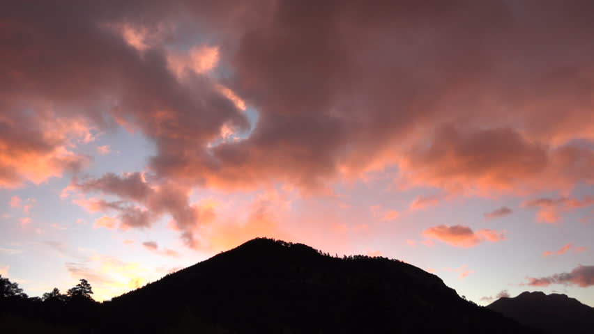 Time lapse of colorful sunrise over the mountains in Rocky Mountain National Park near Estes Park, Colorado