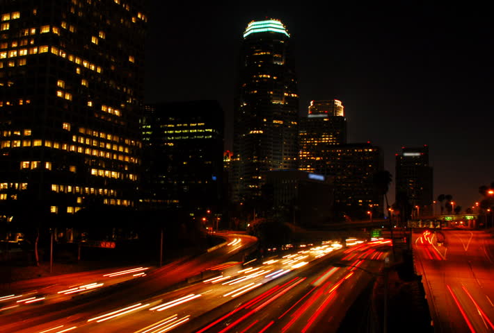 Highway through city at night time lapse