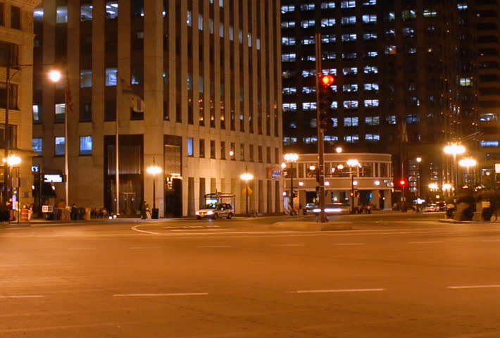 Traffic at a city intersection at night time lapse