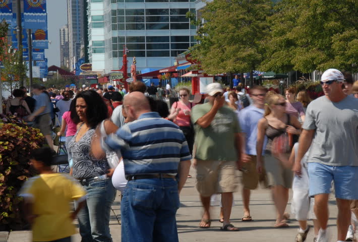 Summertime tourists on crowded sidewalk time lapse