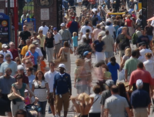 Summertime tourists on crowded sidewalk time lapse