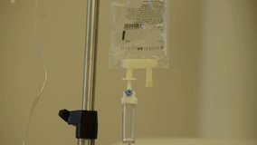 Montage compilation of several videos of medical equipment in real surgery room and emergency room in Israel: Nurse with IV solution infusion in different surgery rooms with monitor on background