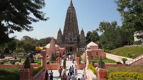 BODHGAYA, INDIA - FEBRUARY 27: People visiting the Mahabodhi Temple in Bodhgaya, India. The temple marks the location where Gautama Buddha is said to have attained enlightenment some 2500 years ago.