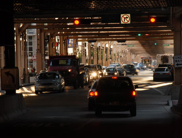 Urban intersection under railroad tracks time lapse