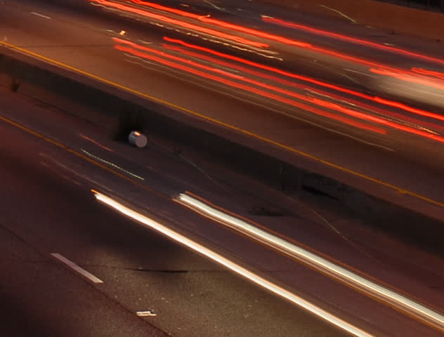 Speeding cars at night rush hour motion blur