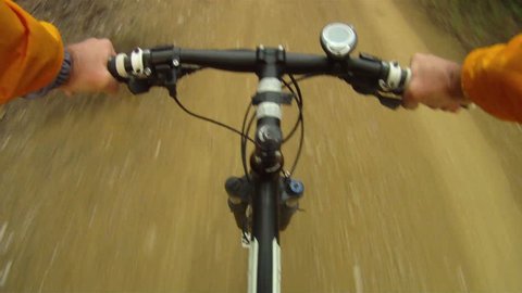 Mountain Bike traveling fast along dirt track Stock Video