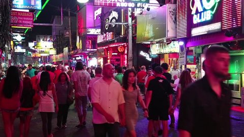 THAILAND, PATTAYA, MARCH 31, 2014: Walking Street is red-light district with many restaurants, go-go bars and brothels, that draws people, primarily for night life and sexual entertainments