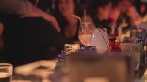 TAIPEI,TAIWAN - CIRCA October 2013 :cinematic dolly shot of bartender mixing a drink