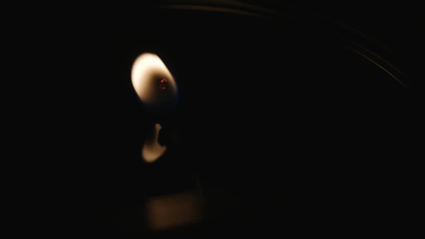 Close up shots of a candle wick flame burning sensually with reflections. Macro | Shutterstock HD Video #8041027