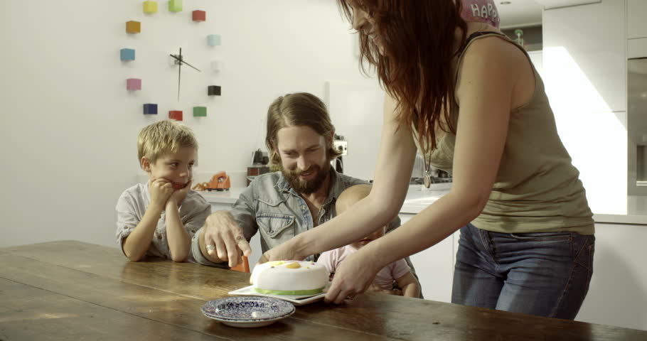 Family celebrating birthday with cake | Shutterstock HD Video #8044210