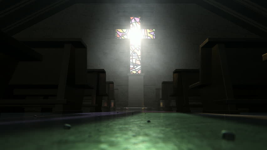 A a pan across the aisle of an old church lit by suns rays penetrating through a stained glass window in the shape of a crucifix reflecting colors on the floor in amongst rows of church pews | Shutterstock HD Video #8044528