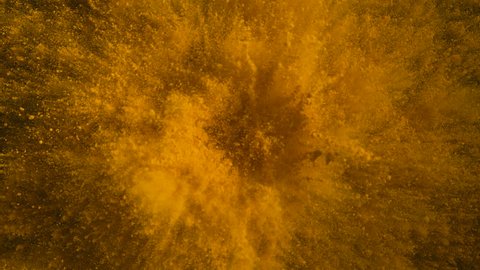 Colorful powder/particles fly after being exploded against black background. Shot with high speed camera, phantom flex 4K. Slow Motion. Unedited version is included at the end of clip.