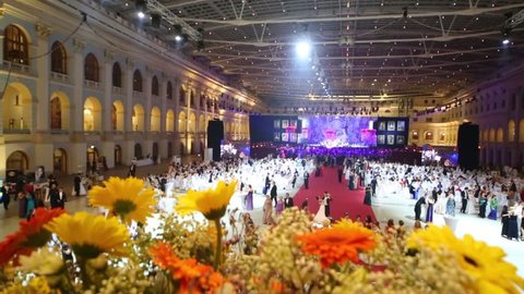 MOSCOW, RUSSIA - MAY 25, 2013: Yellow flowers and fandango at 11th Viennese Ball in Gostiny Dvor