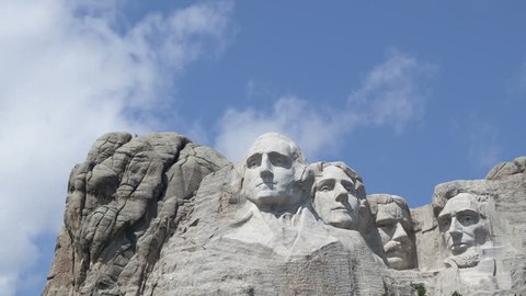Time lapse close up Mt. Rushmore National Memorial Park in South Dakota. Sculptures of former U.S. presidents: George Washington, Thomas Jefferson, Theodore Roosevelt and Abraham Lincoln.