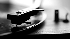 Close up of vintage gramophone needle playing, black and white video