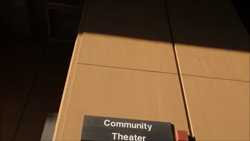 community theater sign on college campus
