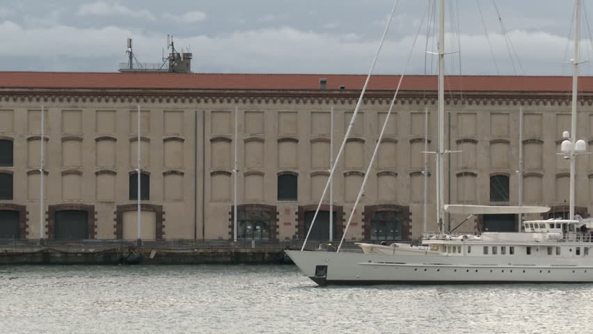 Old vessel entering slowly in the port of Genoa, Italy
