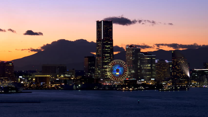 close up Timelapse view of yokohama at twilight with minatomirai and Mt Fuji on the background