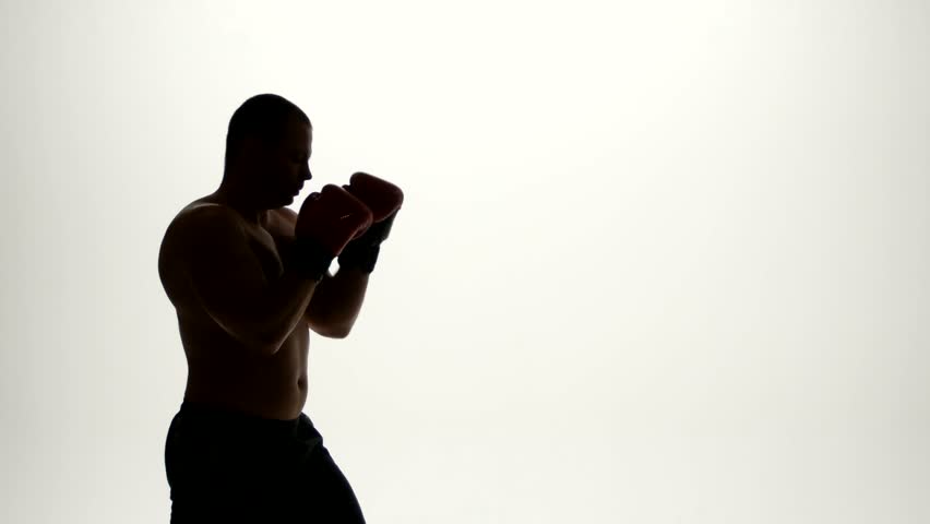 one caucasian man exercising boxing boxer workout fitness in silhouette studio  isolated on white background