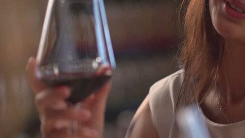 Stock video footage restaurant girls clink glasses red wine