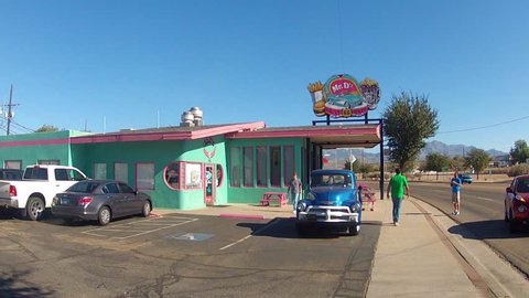 KINGMAN, AZ: October 31, 2014- Shot of people at a classic roadside hamburger joint circa 2014 in Kingman Arizona. Customers patronize a small local burger grill eatery along the Famous Route 66.
