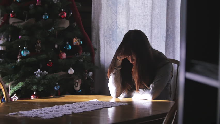 young woman with a headache at christmas