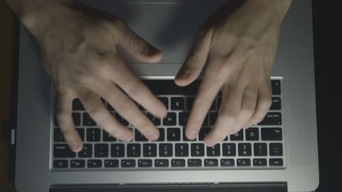 an above shot of a hands getting frustrated at a computer