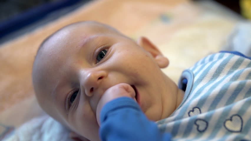 infant hands in mouth