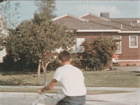 UNITED STATES CIRCA 1960 - Newspaper printing process. Paper boy delivers papers to houses and establishments in a roundabout until the newspaper reaches the hands of the barbershop clients.
